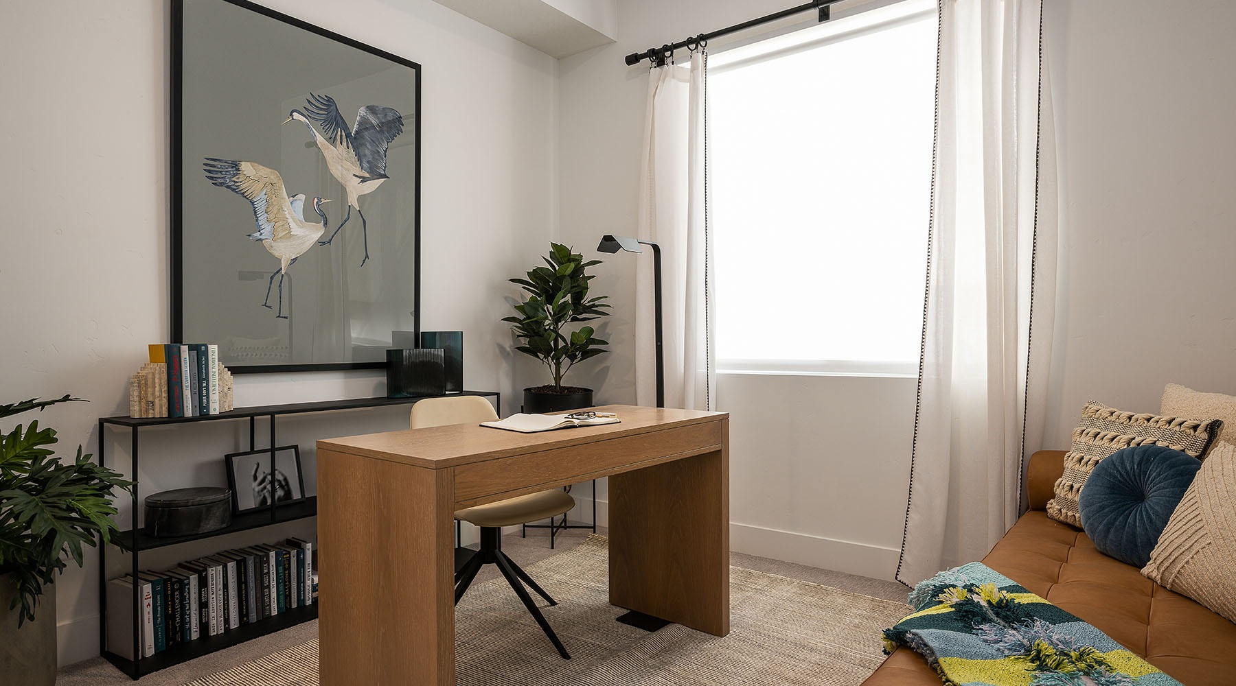 Welcome Home a bedroom with a desk and a couch