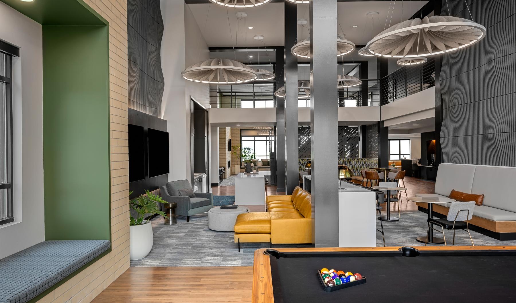 The essence of exceptional living a room with a pool table and couches