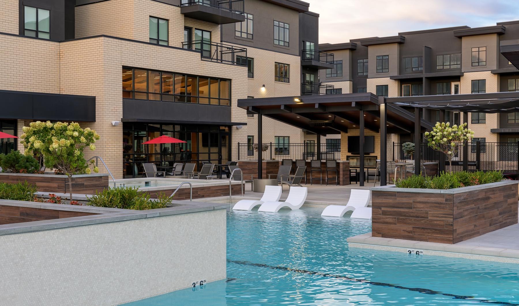 Resort-style swimming pool a swimming pool with seating